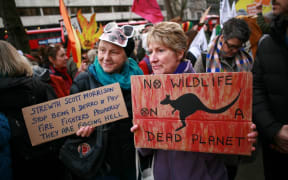 Members of climate change activist movement Extinction Rebellion (XR) protest the Australian government's response to its ongoing bushfires emergency at a demonstration outside the Australian High Commission in London, England.