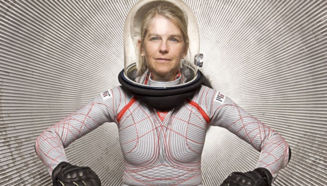 Dr Dava Newman modelling her Biosuit. The biosuit is a tight, form fitting spacesuit with a clear bubble helmet.