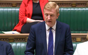 In this video grab taken from footage broadcast by the UK Parliamentary Recording Unit (PRU) via the Parliament TV website on March 25, 2024, Britain's Chancellor of the Duchy of Lancaster and Deputy Prime Minister Oliver Dowden makes a statement on Chinese cyber attacks, in the House of Commons.