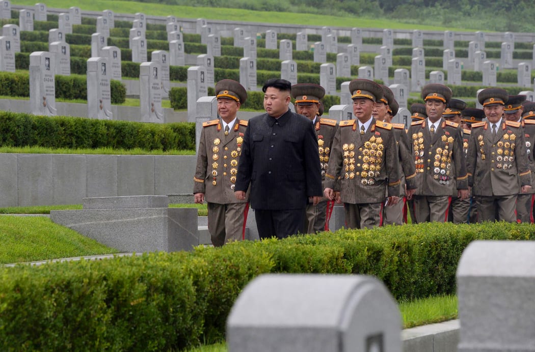 North Korean leader Kim Jong-Un (C) visiting the Fatherland Liberation War Martyrs Cemetery in Pyongyang.