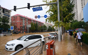 Cars caught in floodwater in Mentougou District of Beijing, China, 31 July 2023.