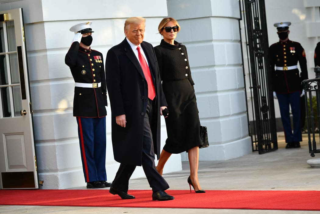 Donald Trump and First Lady Melania make their way to board Marine One, leaving the White House for the final time.