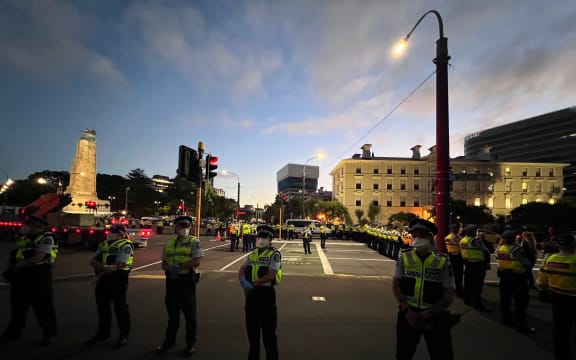 Police have dropped back and are now holding the line at the back entrance to Parliament.