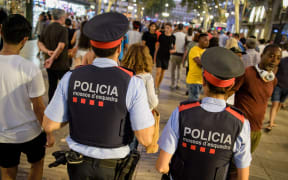Police patrol Barcelona's Las Ramblas over the weekend following a terrorist attack that killed 13 people.