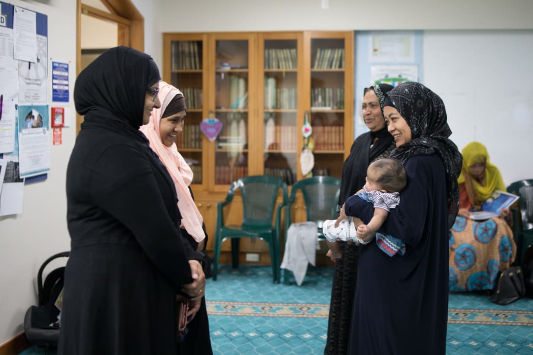 Hamimah meets Neha and cuddles baby Noor, now three months old. With Asma, Neha, and current Women's Coordinator for Al-Noor Mosque Tooba Habib.