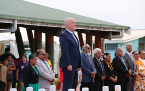 Luxon stands during a ceremony in Niue.