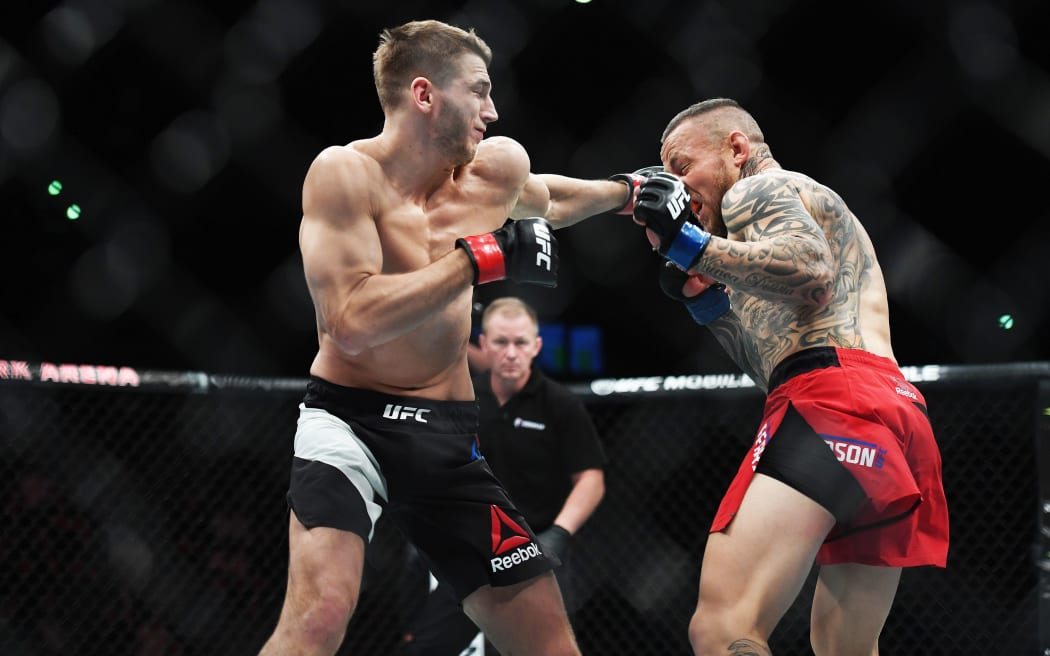 Dan Hooker striking English veteran Ross Pearson at Auckland's UFC Fight Night