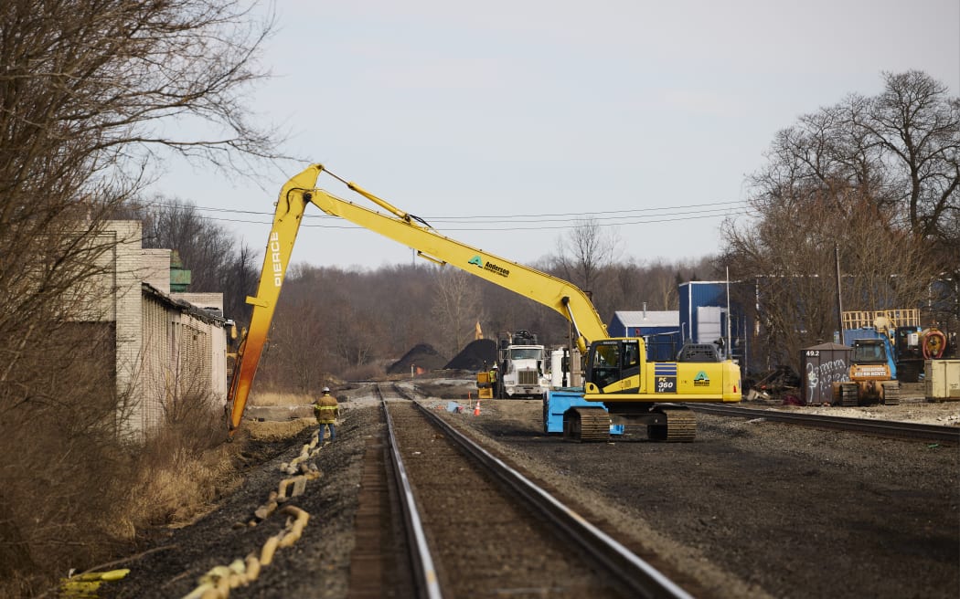 EAST PALESTINE, OH - FEBRUARY 14: Workers remove contaminated dirt near the railroad tracks on February 14, 2023 in East Palestine, Ohio. A train operated by Norfolk Southern derailed on February 3, releasing toxic fumes and forcing evacuation of residents.   Angelo Merendino/Getty Images/AFP (Photo by Angelo Merendino / GETTY IMAGES NORTH AMERICA / Getty Images via AFP)