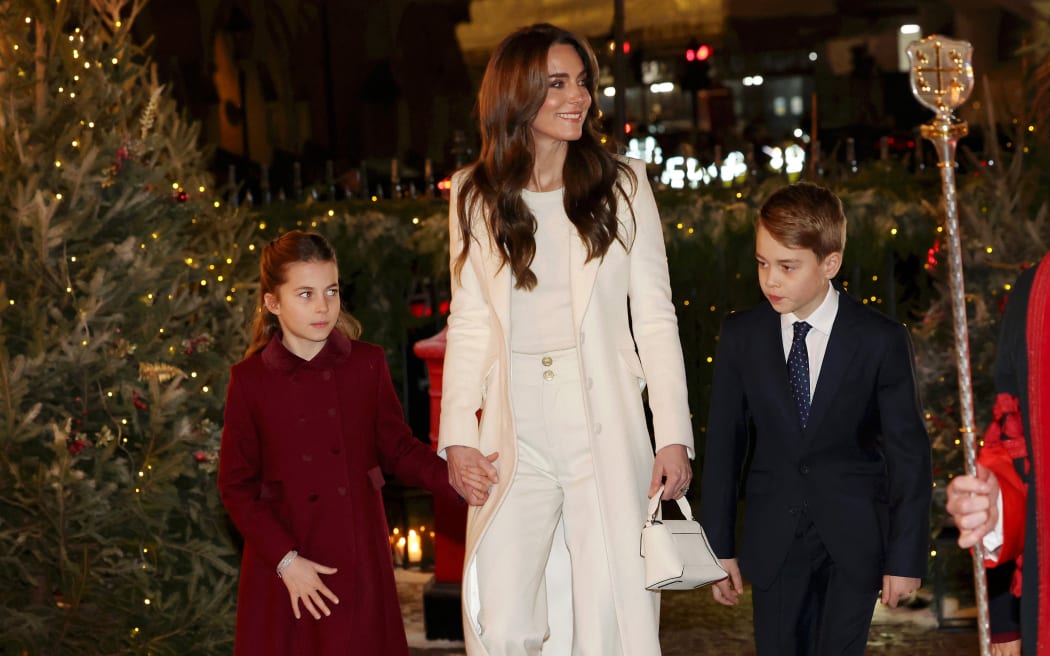 Britain's Catherine, Princess of Wales (C), Britain's Princess Charlotte of Wales (L) and Britain's Prince George of Wales (R) arrive to attend the "Together At Christmas" Carol Service" at Westminster Abbey in London on December 8, 2023.