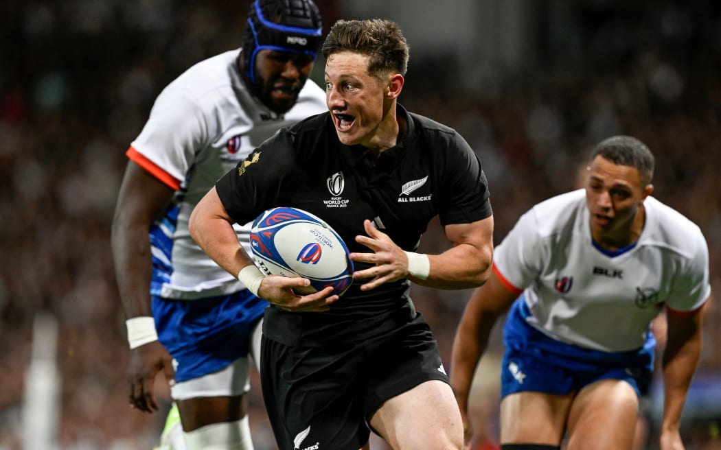 Cam Roigard goes in for the first try of the Rugby World Cup match against Namibia at Stadium de Toulouse.
