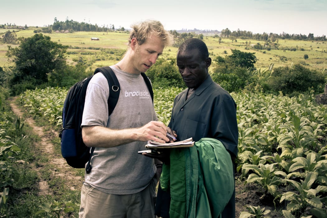 Jake Harriman talking with Agriculture Program Field Manager James Magaigwa Chacha in Kenya