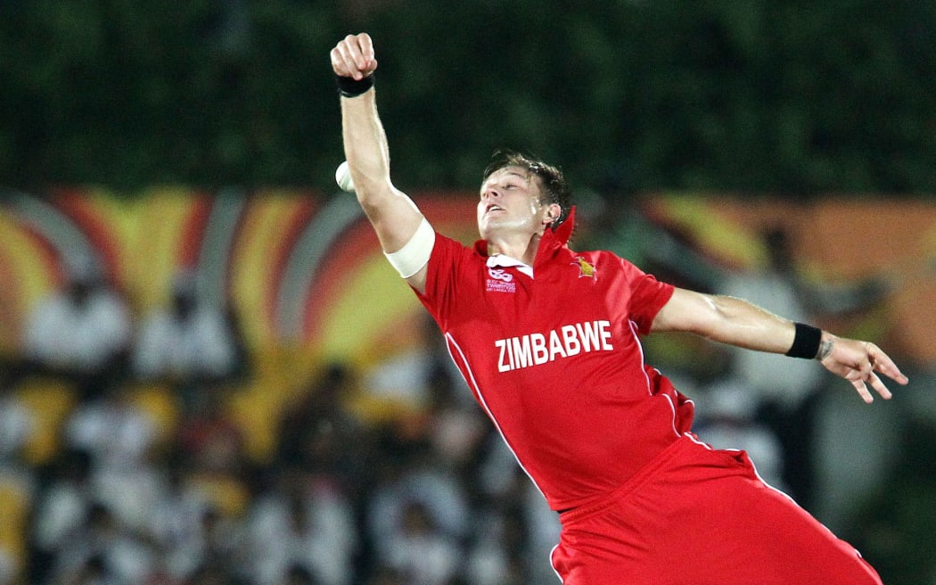 Kyle Jarvis fields from his own bowling during a match between South Africa and Zimbabwe.