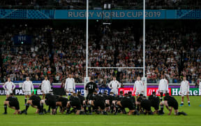 England players lines up among teammates as New Zealand players perform Haka during the 2019 Rugby World Cup semi-final match between England and New Zealand.