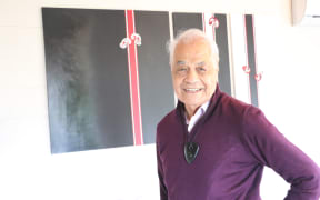 Dr Haare Williams at his Auckland home with one of his art pieces.