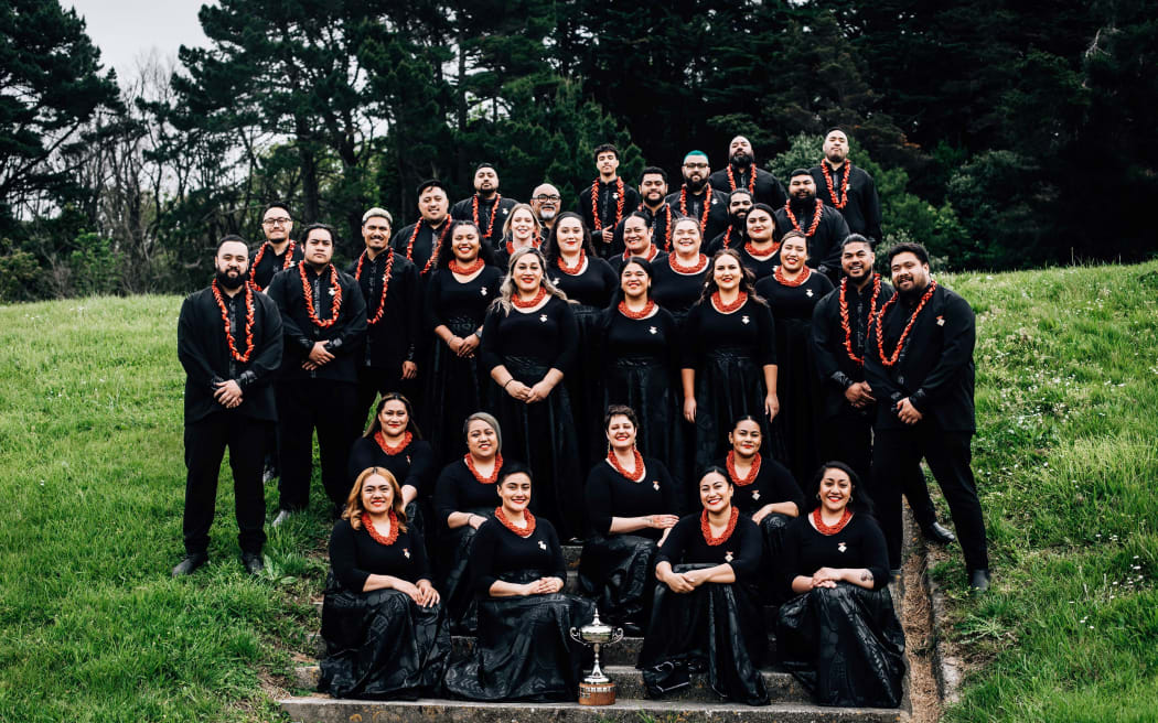 Pacific Connection Choir from Porirua stand and sit on a flight of steps outside.