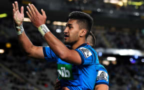 Rieko Ioane celebrates yet another try for the Blues.