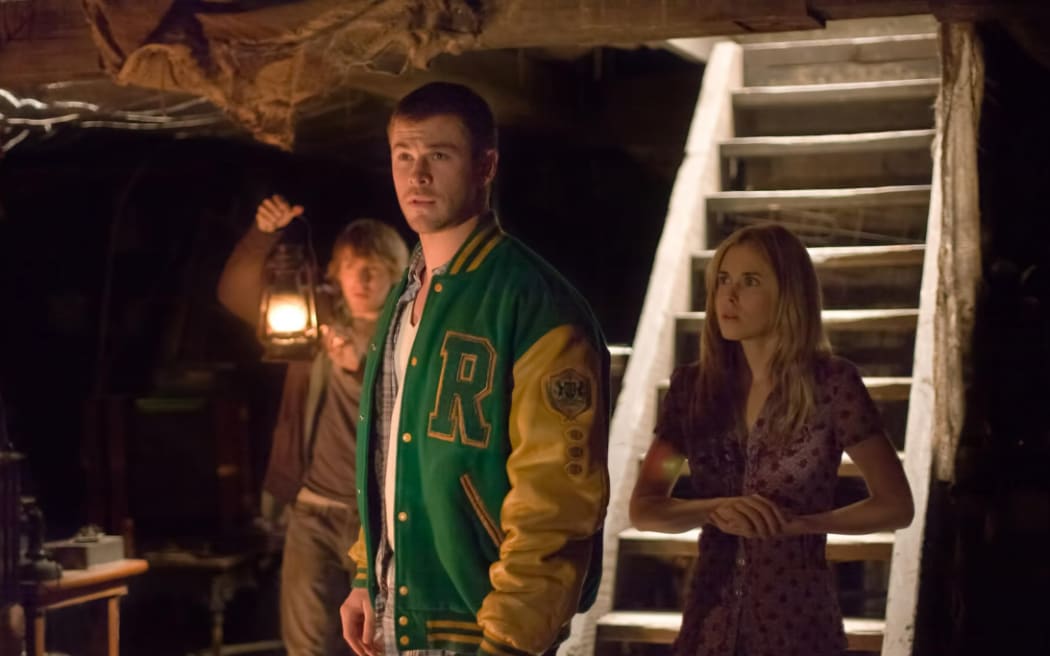 Fran Kranz, Chris Hemsworth, and Anna Hutchison, starring in The Cabin in the Woods (2011).
