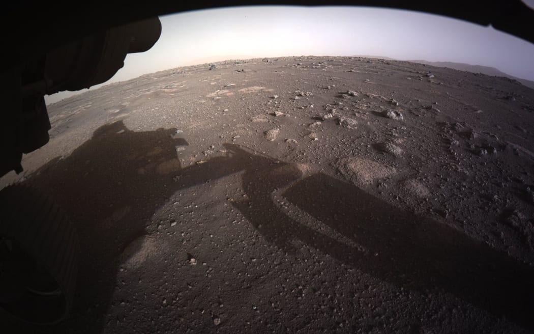 This NASA photo released on February 19, 2021, shows an image from NASAs Perseverance rover as it landed on the surface of Mars on February 18, 2021.