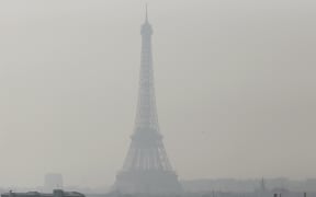 The Eiffel Tower seen through thick smog, on March 2014.