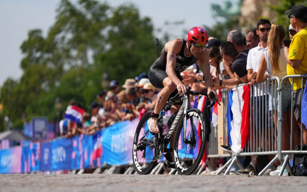 New Zealand's Hayden Wilde competes in the cycling stage during the men's individual triathlon at the Paris 2024 Olympic Games in central Paris on July 31, 2024. (Photo by ALEKSANDRA SZMIGIEL / POOL / AFP)