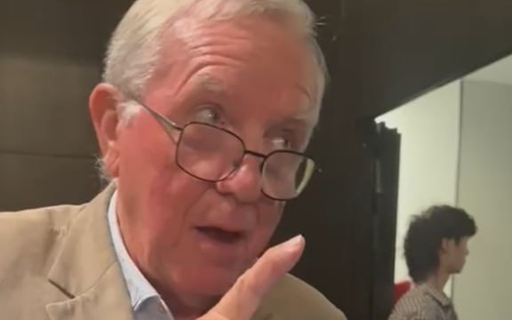 Michael Reed KC can be seen trying to film inside the NZ First event, despite being told numerous times it was not allowed to.