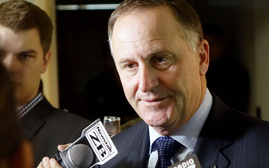 John Key speaking to media in Auckland.