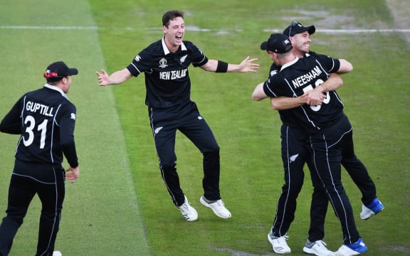 Matt Henry celebrates the dismissal of Karthik and Neesham's catch during the Black Caps semifinal win over India at Old Trafford.