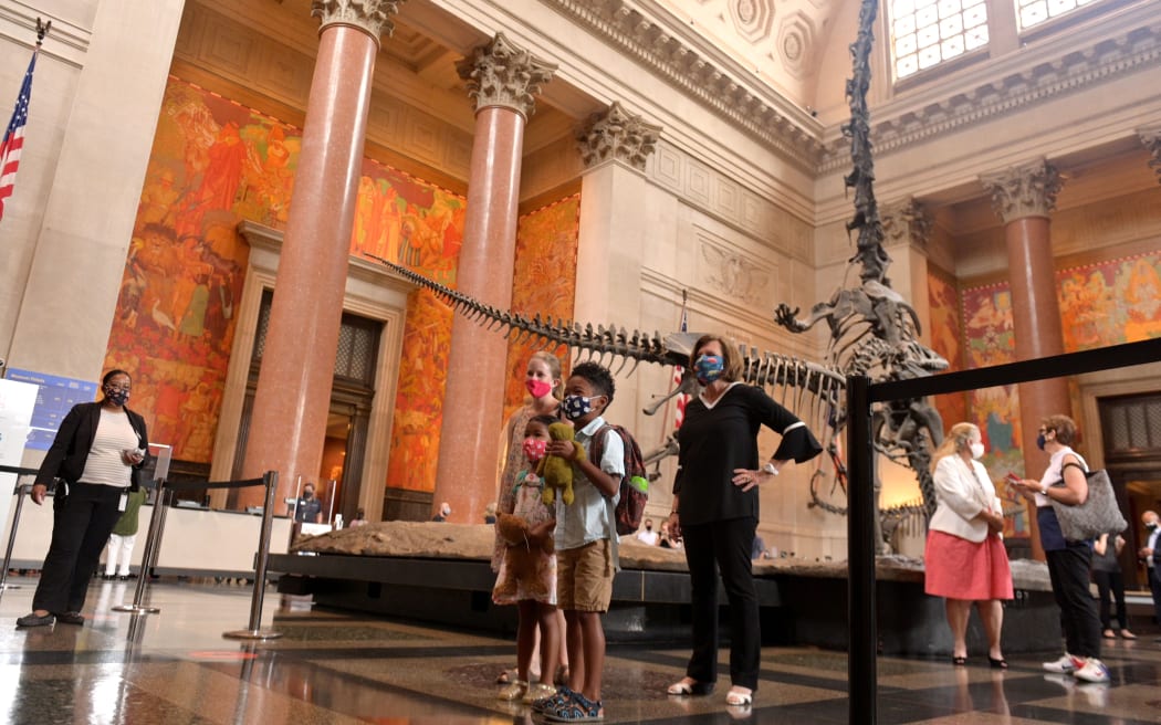 American Museum of Natural History president Ellen V. Futter (C) greets the first group of museum visitors at reopening on September 09, 2020 in New York City, USA