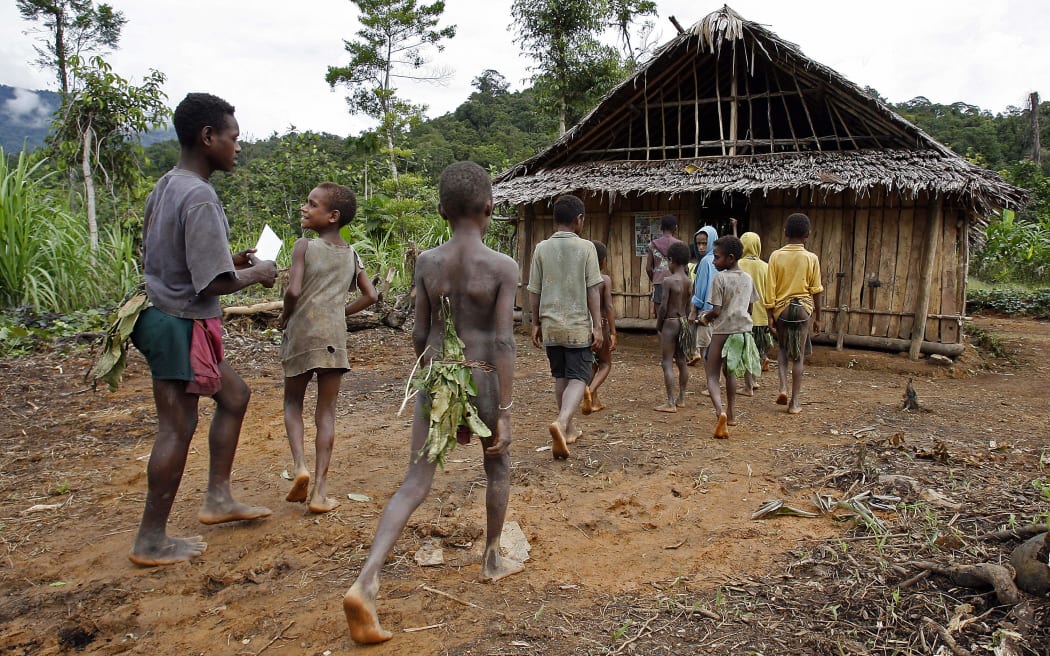 Children of the Andai tribe attend the single-room Lutheran school in Kaiam village in the remote East Sepik province of Papua New Guinea, 05 July 2007.