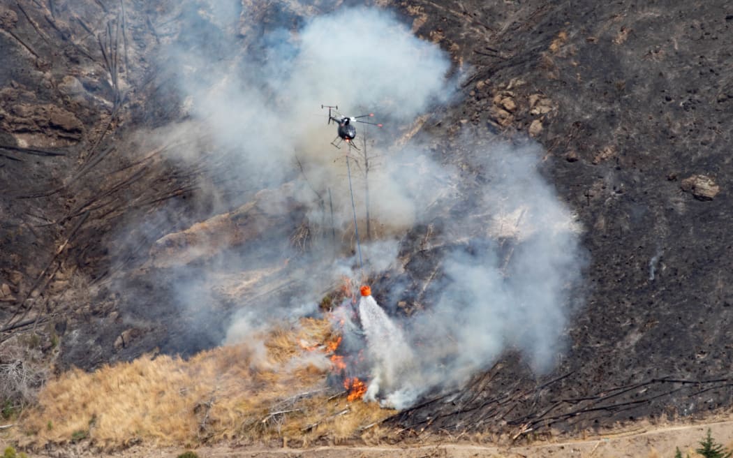 Fire crews battling the Port Hills fire in Christchurch for a second day, on 15 February, 2024.