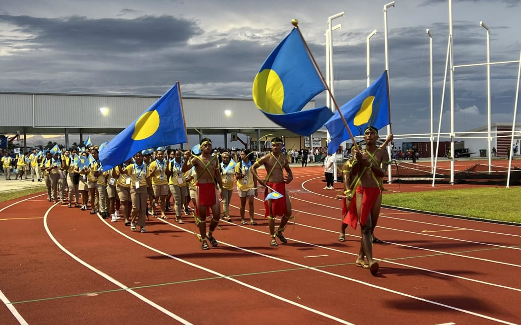 Team Palau marches along the new track field in Majuro for the opening of the 10th Micronesian Games in Majuro.