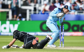 Ross Taylor is run out by Jos Buttler.