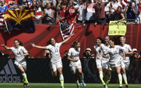 (FILES) In this file photo taken on July 05, 2015 USA midfielder Carli Lloyd (10) celebrates her goal with teammates during the final football match between USA and Japan during their 2015 FIFA Women's World Cup at the BC Place Stadium in Vancouver. )