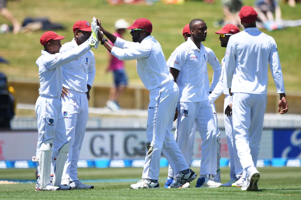 West Indies celebrate the wicket of Latham