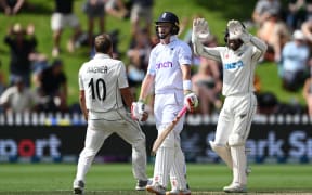 Ollie Pope of England heads back to the dresssing room as Neil Wagner and Tom Blundell celebrate.
New Zealand Black Caps v England. Day 5 of the second cricket test at the Basin Reserve, Wellington, New Zealand. Feb 28, 2023. ( Andrew Cornaga / Photosport )