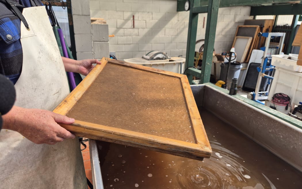 Pieces of paper are pullled using a mold, decal and screen.