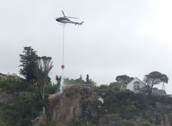 Water was being dropped to clear the site of debris.