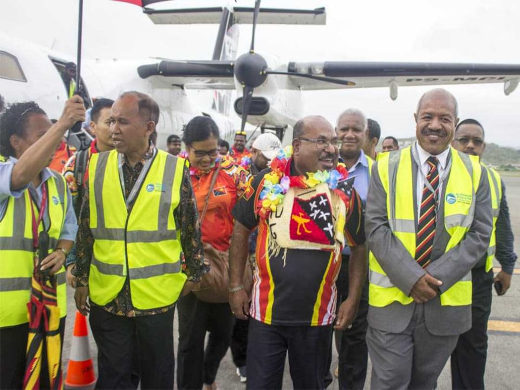 From left: Indonesian ambassador to PNG, His Excellency Ronald Manik, Governor Enembe, Governor Parkop and others walking out of the tarmac at Jackson's International Airport in Port Moresby.