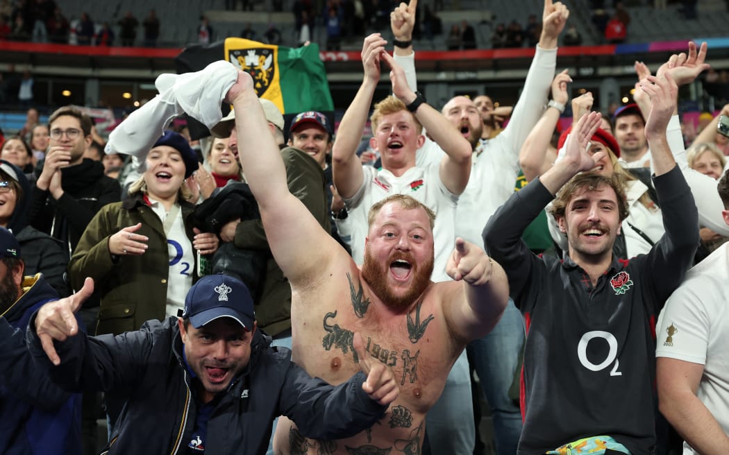 England supporters celebrate after their team won the  France 2023 Rugby World Cup third-place match between Argentina and England at the Stade de France in Saint-Denis, on the outskirts of Paris, on October 27, 2023. (Photo by FRANCK FIFE / AFP)