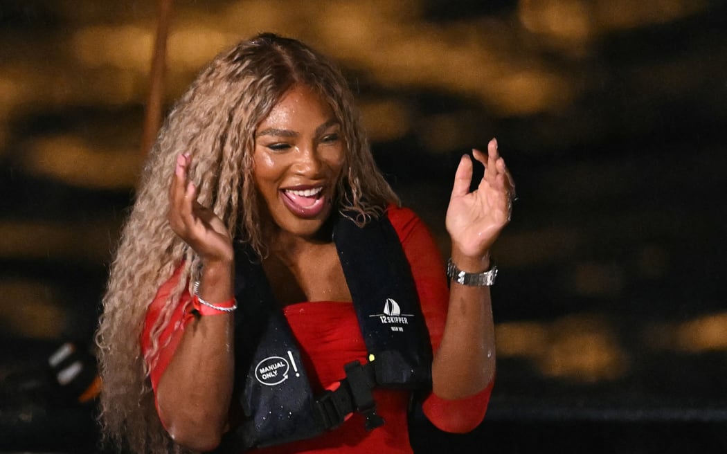 US tennis player Serena Williams reacts prior to hand over the Olympics torch during the opening ceremony of the Paris 2024 Olympic Games.
