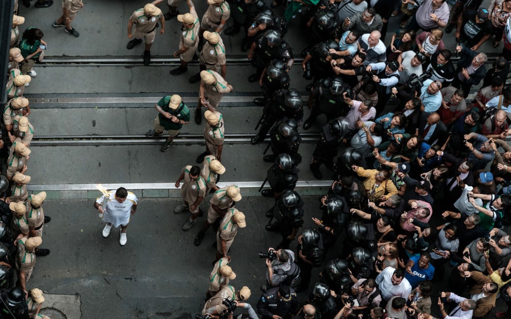 The torch ceremony would be met with protest in neighboring towns, where police clashed with demonstrators ahead of the torch's arrival.