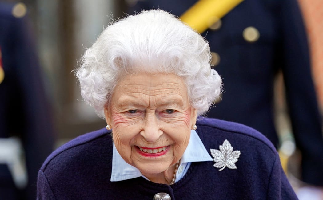 (FILES) In this file photo taken on October 6, 2021 Britain's Queen Elizabeth II gestures as she meets representatives of the Royal Regiment of Canadian Artillery to mark the 150th Anniversary of the foundation of A and B Batteries, at Windsor Castle, Windsor. - A