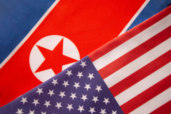 The North Korean and US flags.