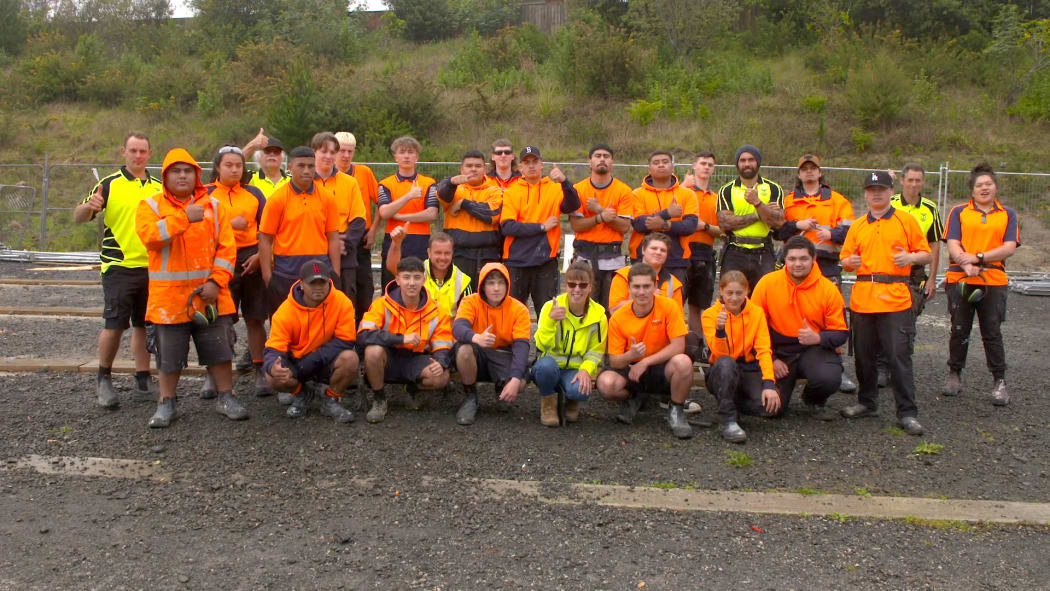 Students from the Massey High School Building Academy, who built state houses as part of a partnership with Kāinga Ora.