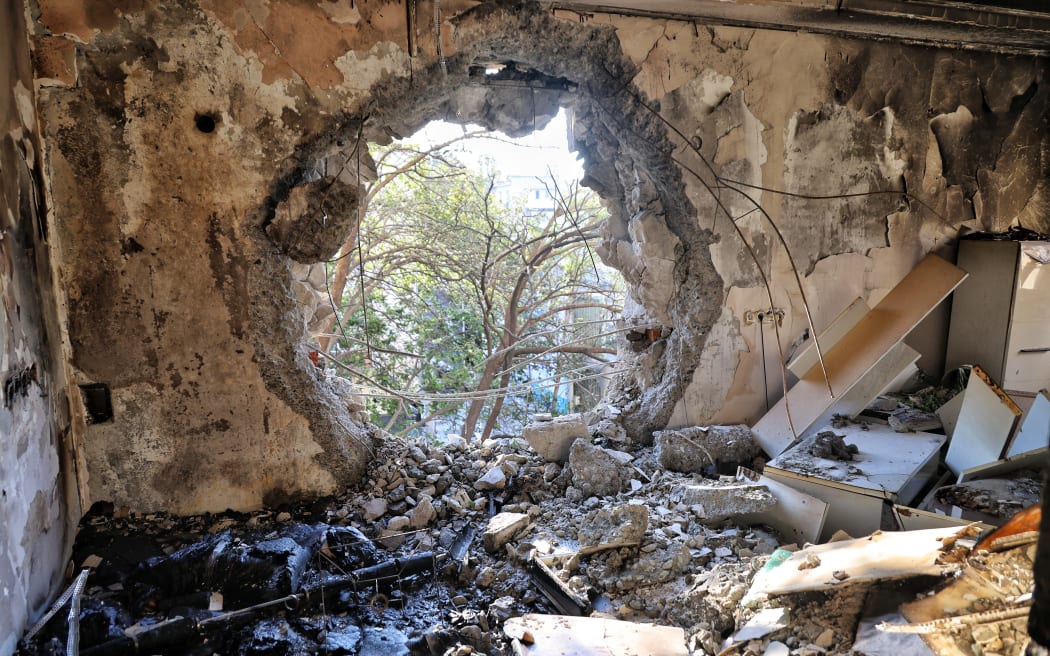 A hole from the strike of a Russian drone is in the wall of an apartment block in the Prymorskyi district of Odesa, Ukraine, on September 7, 2025. (Photo by Nina Liashonok/Ukrinform/NurPhoto) NO USE RUSSIA. NO USE BELARUS. (Photo by Nina Liashonok / NurPhoto via AFP)