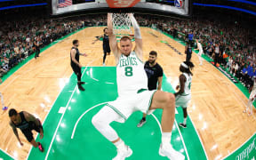 Kristaps Porzingis of the Boston Celtics dunks the ball during his side's win over the Dallas Mavericks in game one of the NBA Finals.