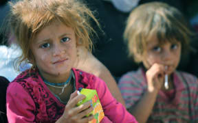 Several thousand from the the Yazidi community have crossed the Syrian-Iraqi border.