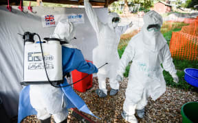 Medical staff of the Ebola Treatment Unit (ETU) get ready to work in their Personal Protective Equipment (PPE) during their weekly rehearsal at the Bwera General Hospital in Bwera bordering with DRC, western Uganda, on December 12, 2018.