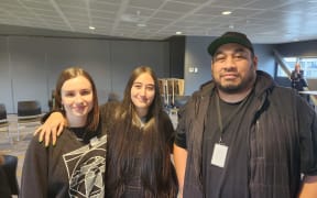Former alternative education student Hayley-Jane with her former teachers Rose McIlhone and Nathaniel Hakeagaiki.