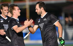 Nic Woods (R).
